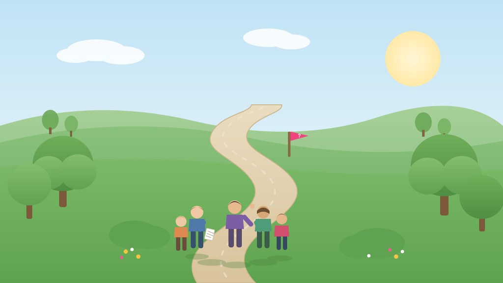 Corporate team from Slots UK walking a trail through Pittencrieff Park and solving clues together in the park